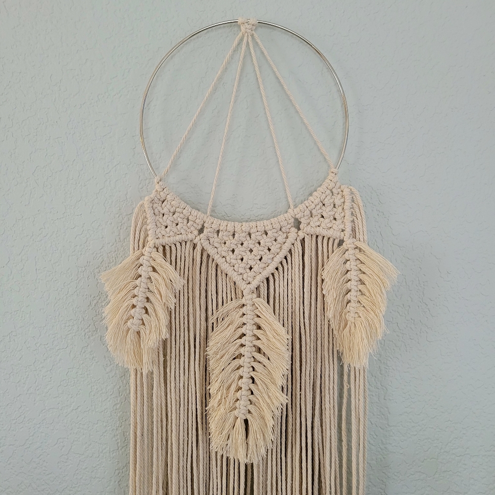 handmade boho macrame wall art hanging wreath in natural on hoop with feathers